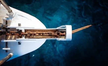 Why do we sometimes have two anchors of different cable lengths onboard ships ?